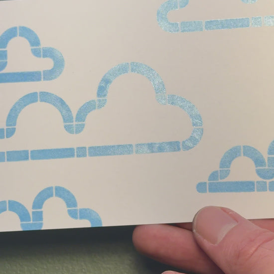Print of clouds on a piece of white cardstock using Tsukineko Brilliance Pearlescent Sky Blue ink